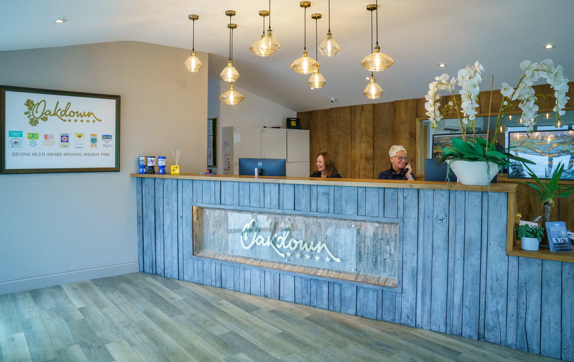 The reception building from the doorway, with the planked desk running along one side and the timber floor in front